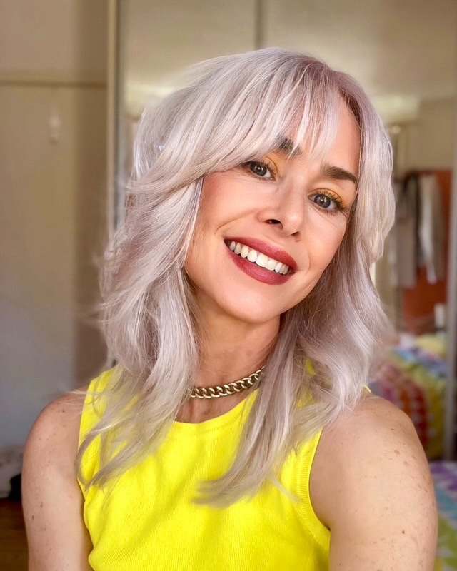 Icy Blonde Shag With Textured Curtain Bangs