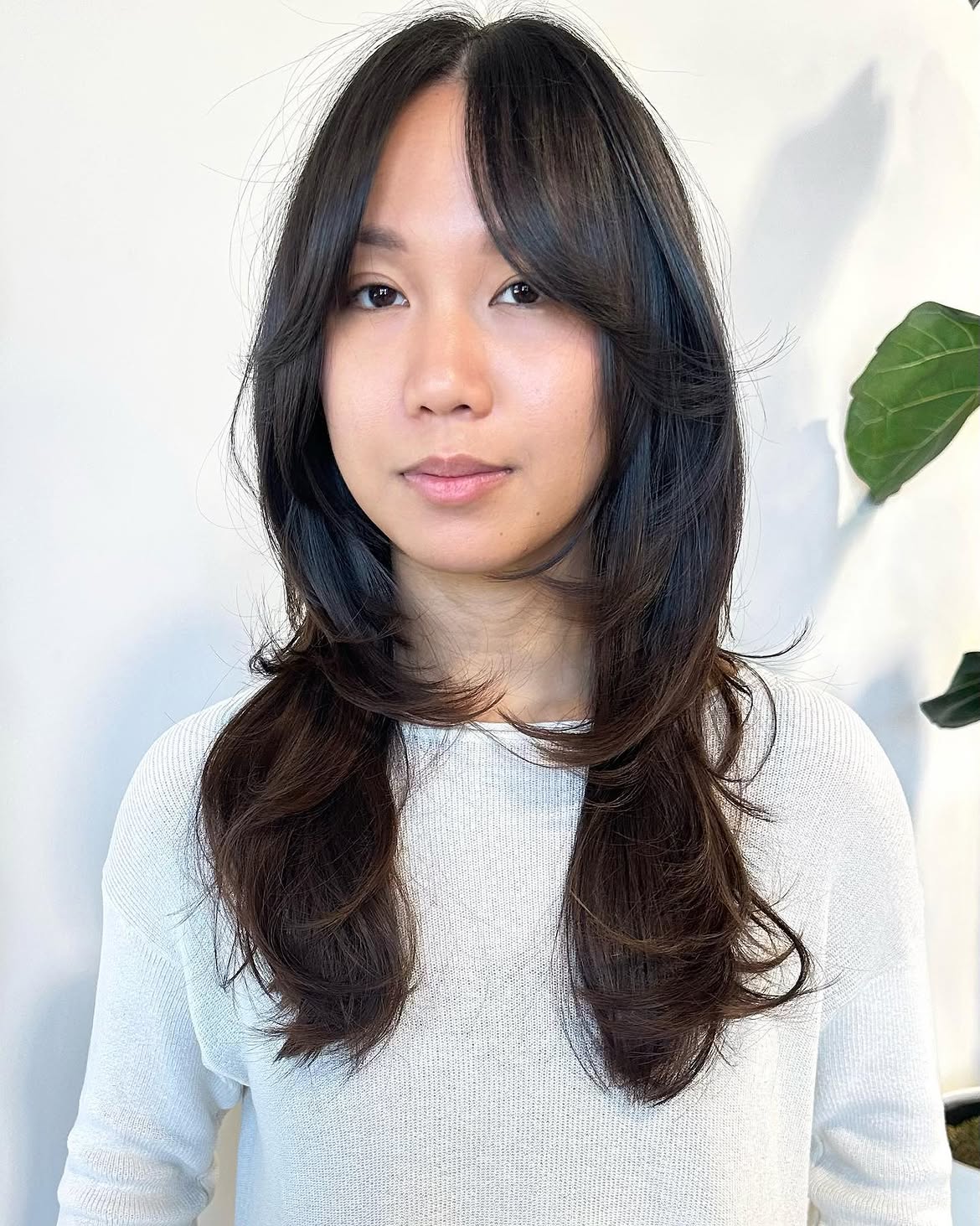 Layered Collarbone Cut With Face-Framing Bangs