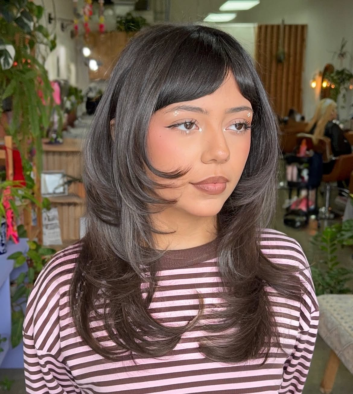 Layered Mid-Length Cut With Face-Framing Bangs