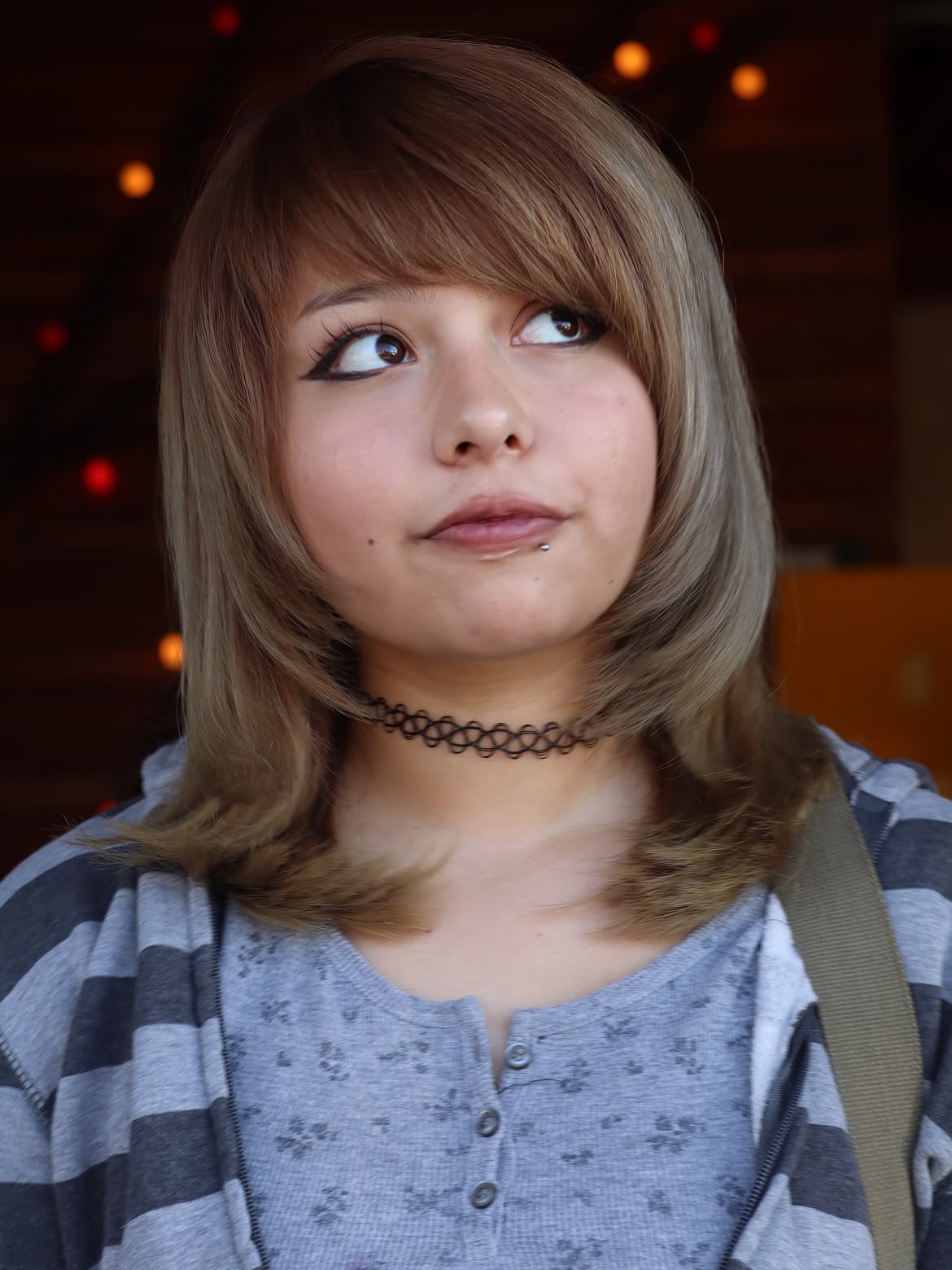 Layered Mid-Length Cut With Wispy Bangs And Ashy Tones