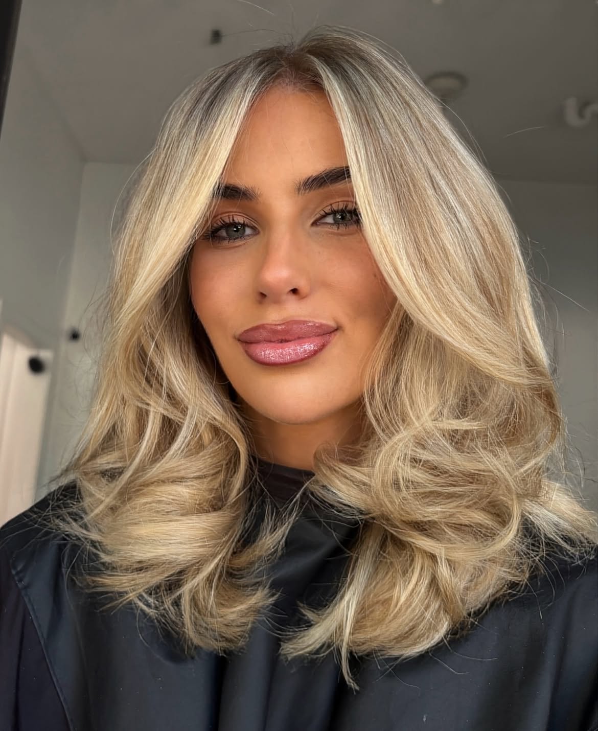Lived In Honey Blonde With Voluminous Curtain Bangs