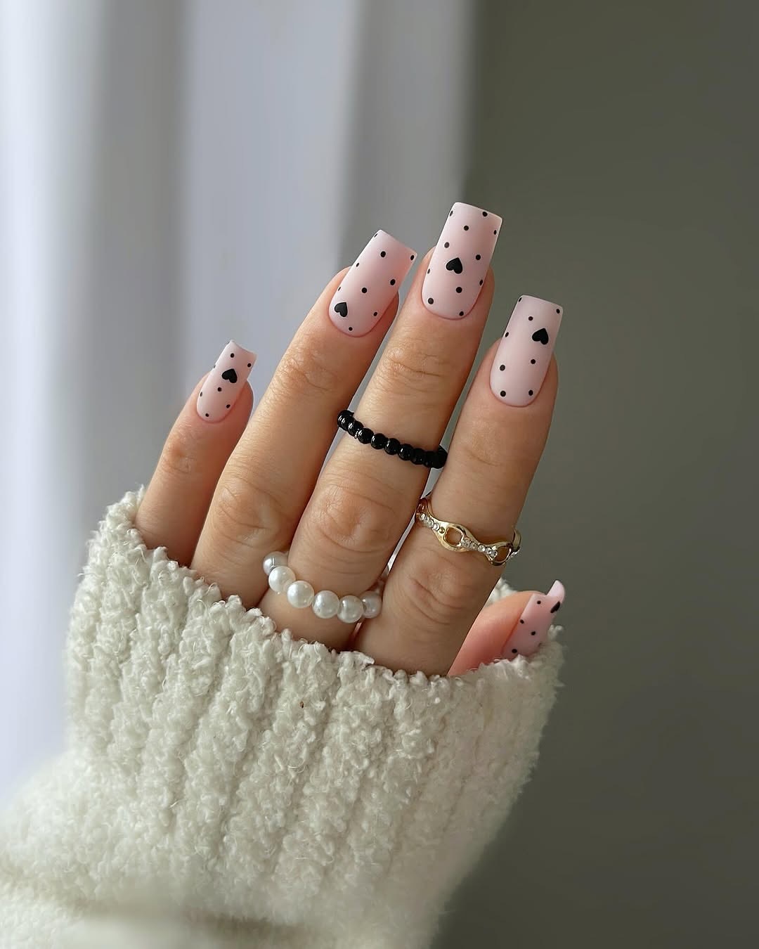 Matte Pink Square Nails with Black Hearts and Dots