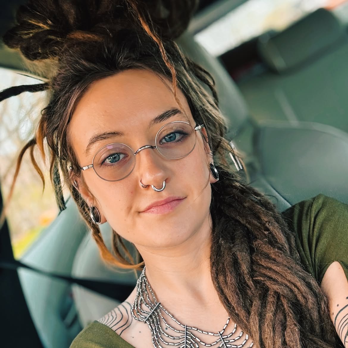Messy Top Knot Dreads With Face-Framing Strands