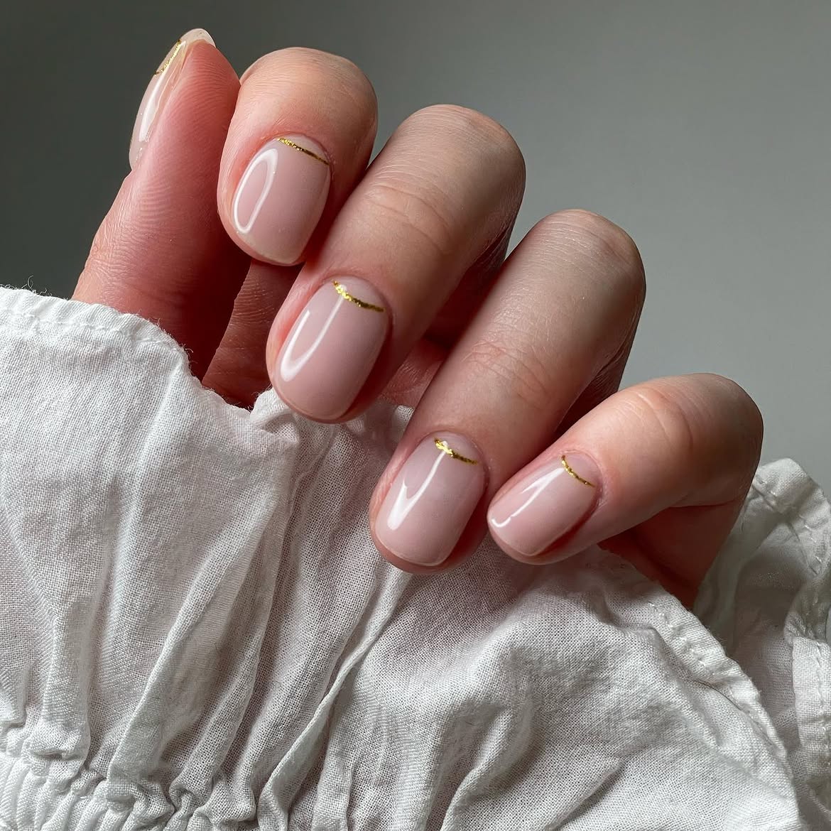 Milky Nude Nails With Delicate Gold Stripe