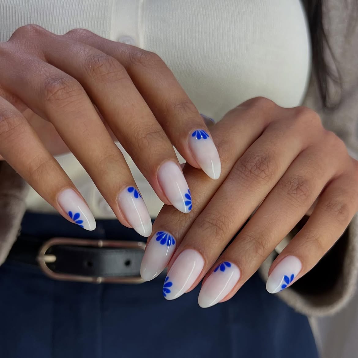 Milky White Almond Nails With Blue Floral Accents