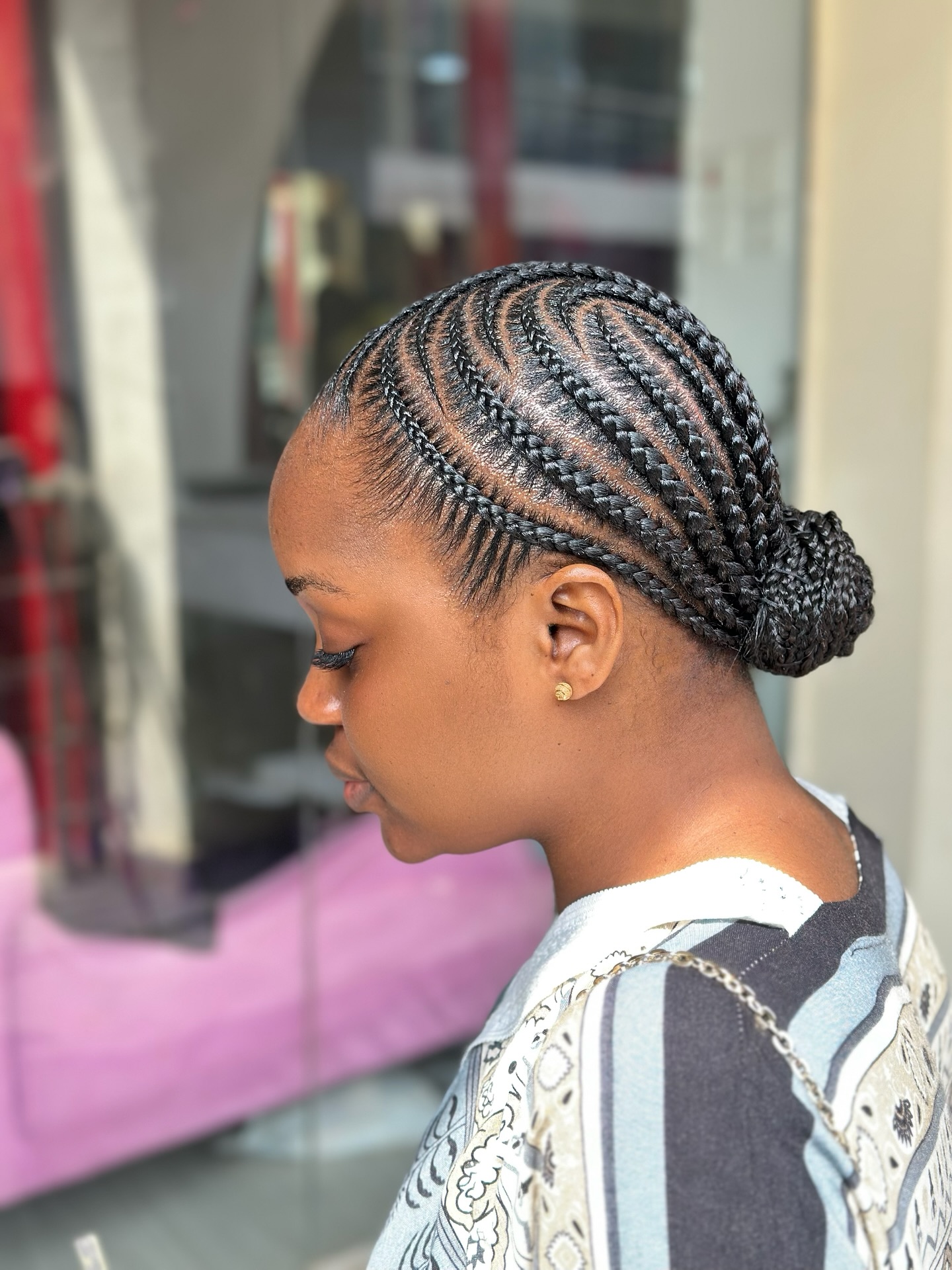 Neat Cornrows Styled Into a Chic Low Bun