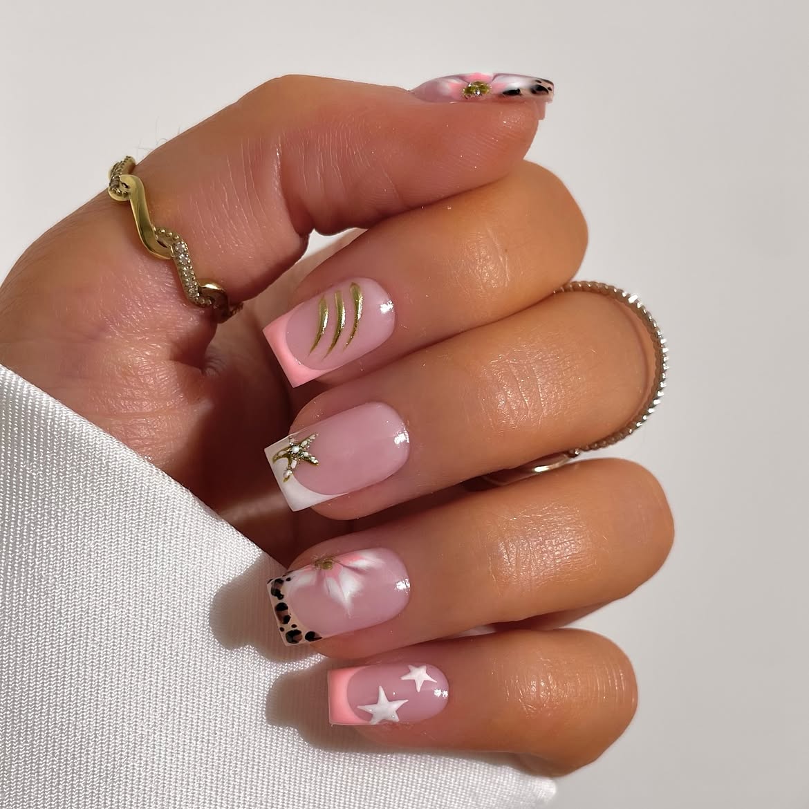 Pink French Tips with Star & Swirl Accents