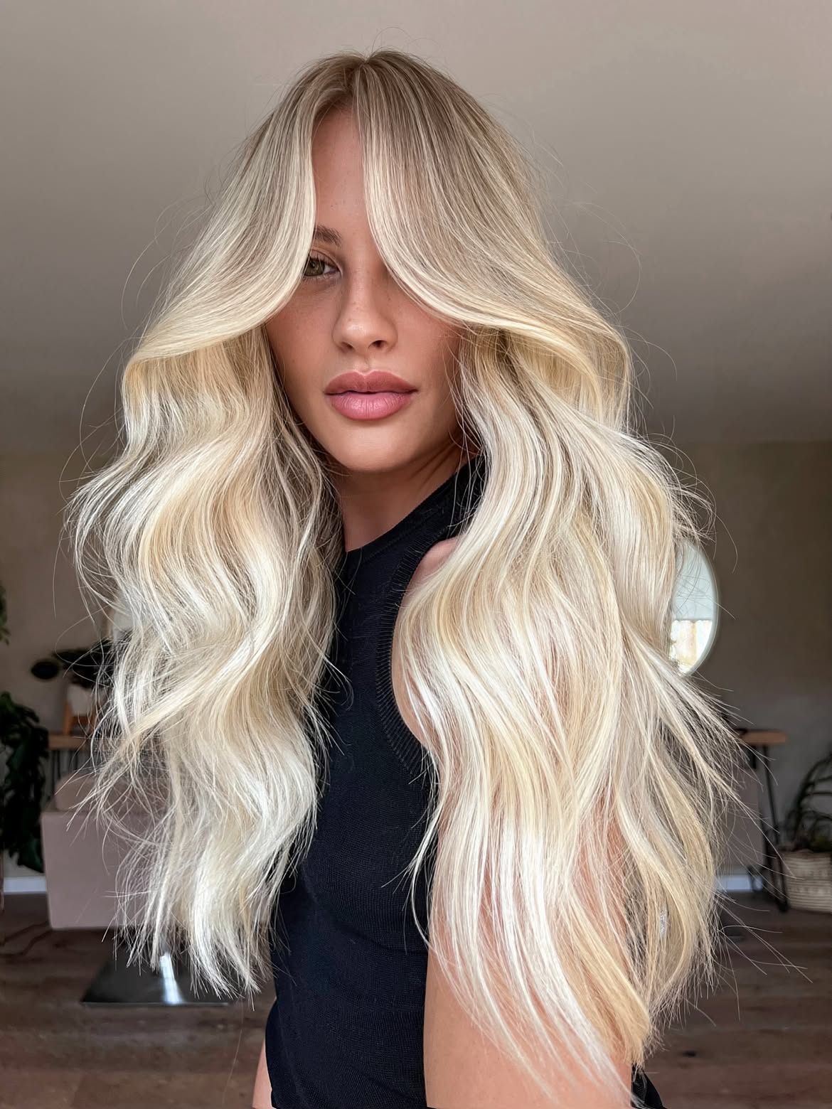 Platinum Blonde Beach Waves With Face Framing Layers