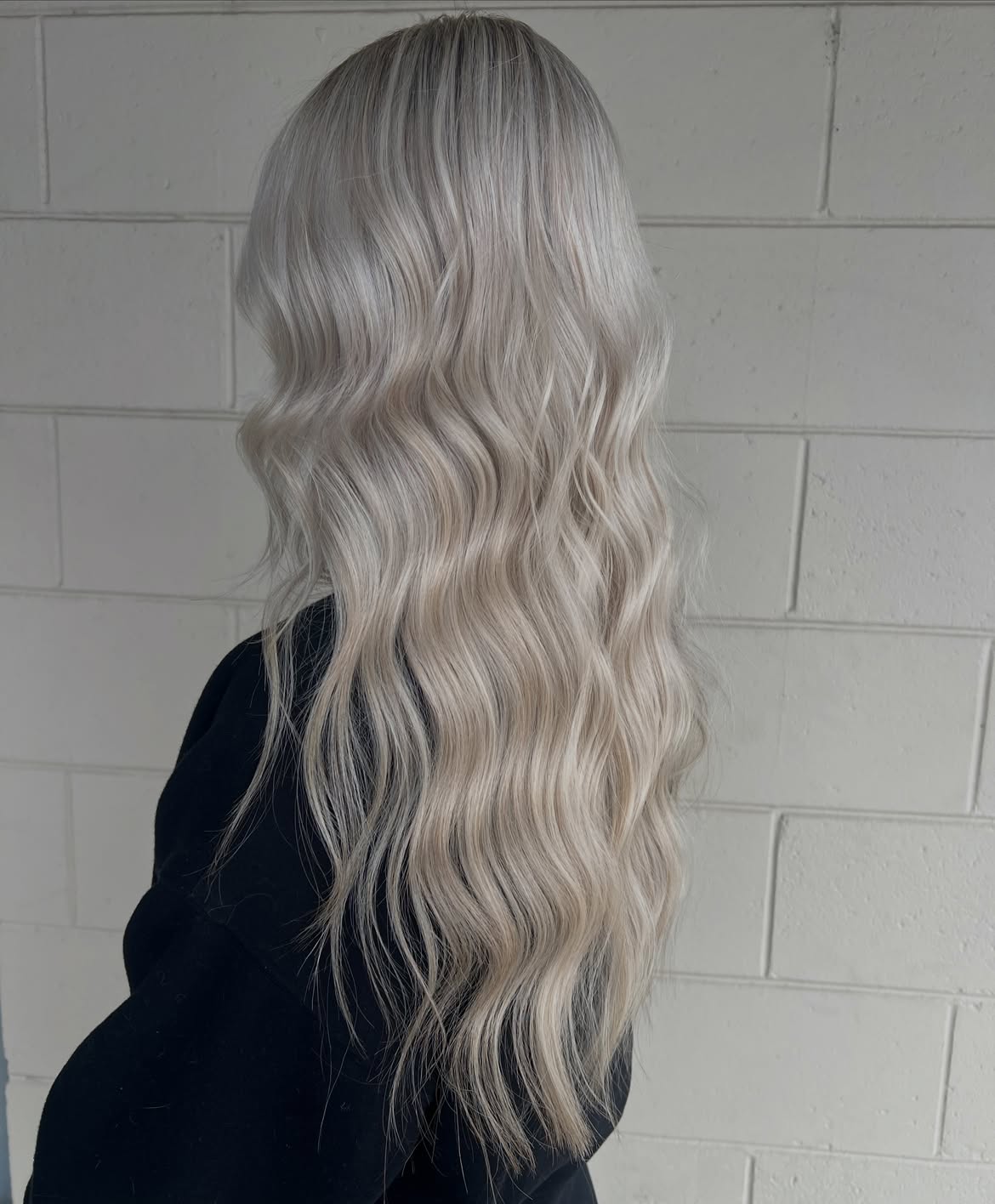 Platinum Blonde Beach Waves With Lived-In Roots