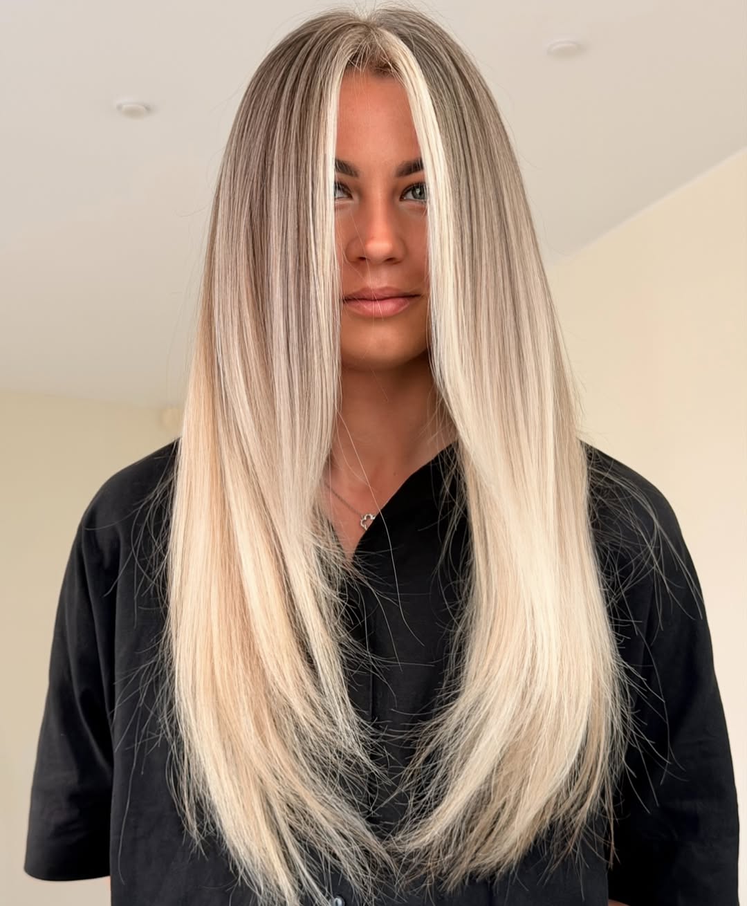 Platinum Blonde Money Piece With Long Layered Waves
