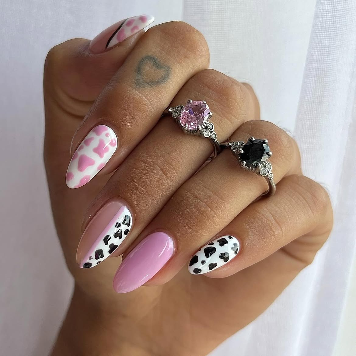 Playful Pink Cow Print Almond Nails