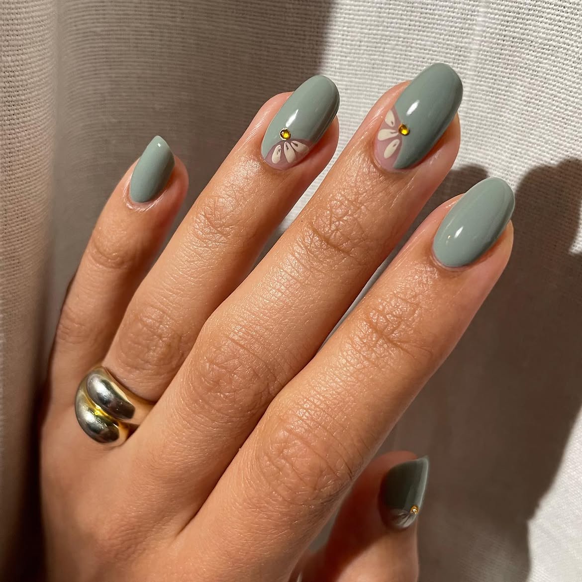 Sage Green Oval Nails With Delicate Flower Art