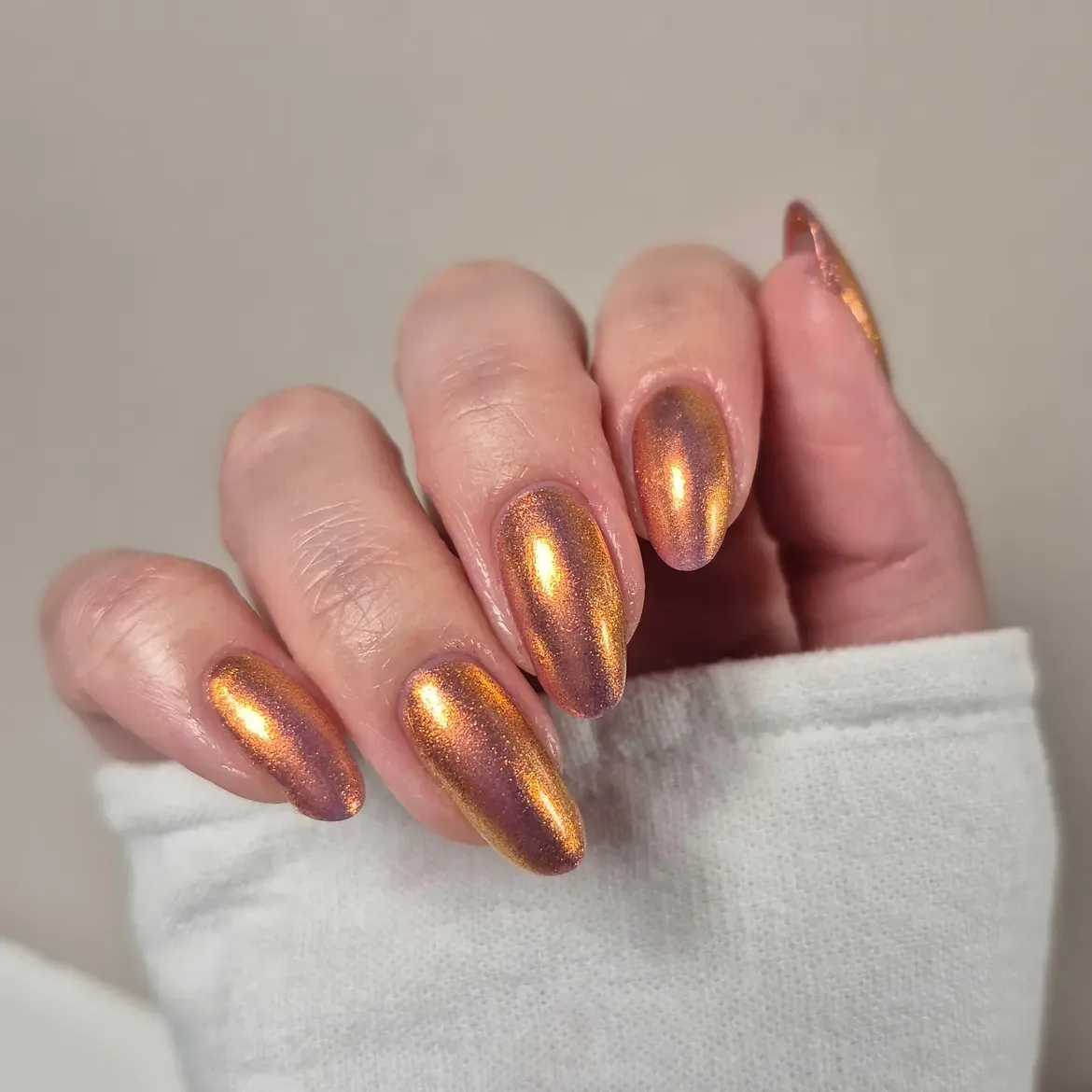 Shimmering Copper Metallic Almond Nails