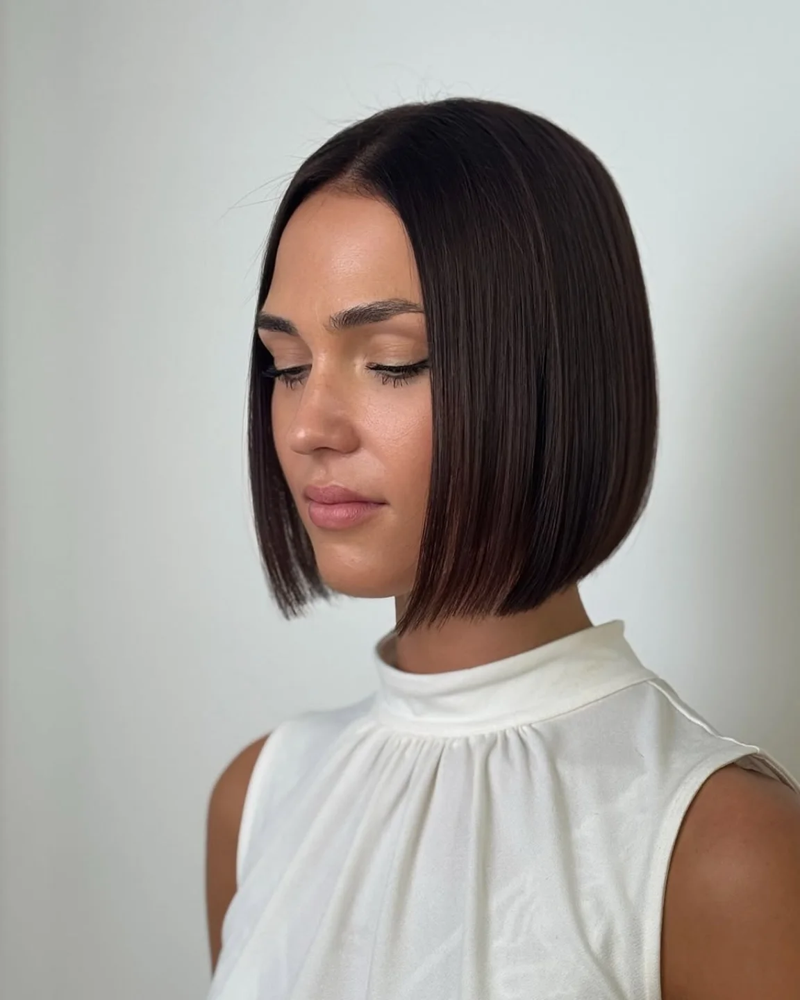 Sleek Chin Length Bob With Subtle Chocolate Tones