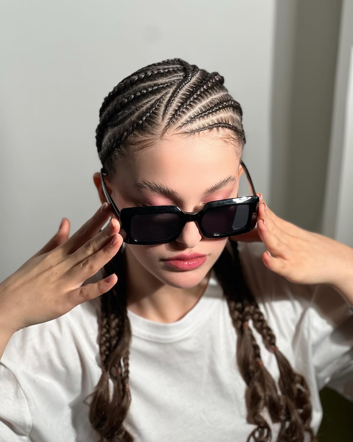 Sleek Cornrow Braids With Flowing Braided Ponytails
