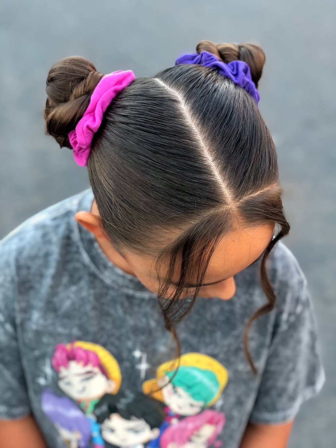 Sleek Double Space Buns With Colorful Scrunchies