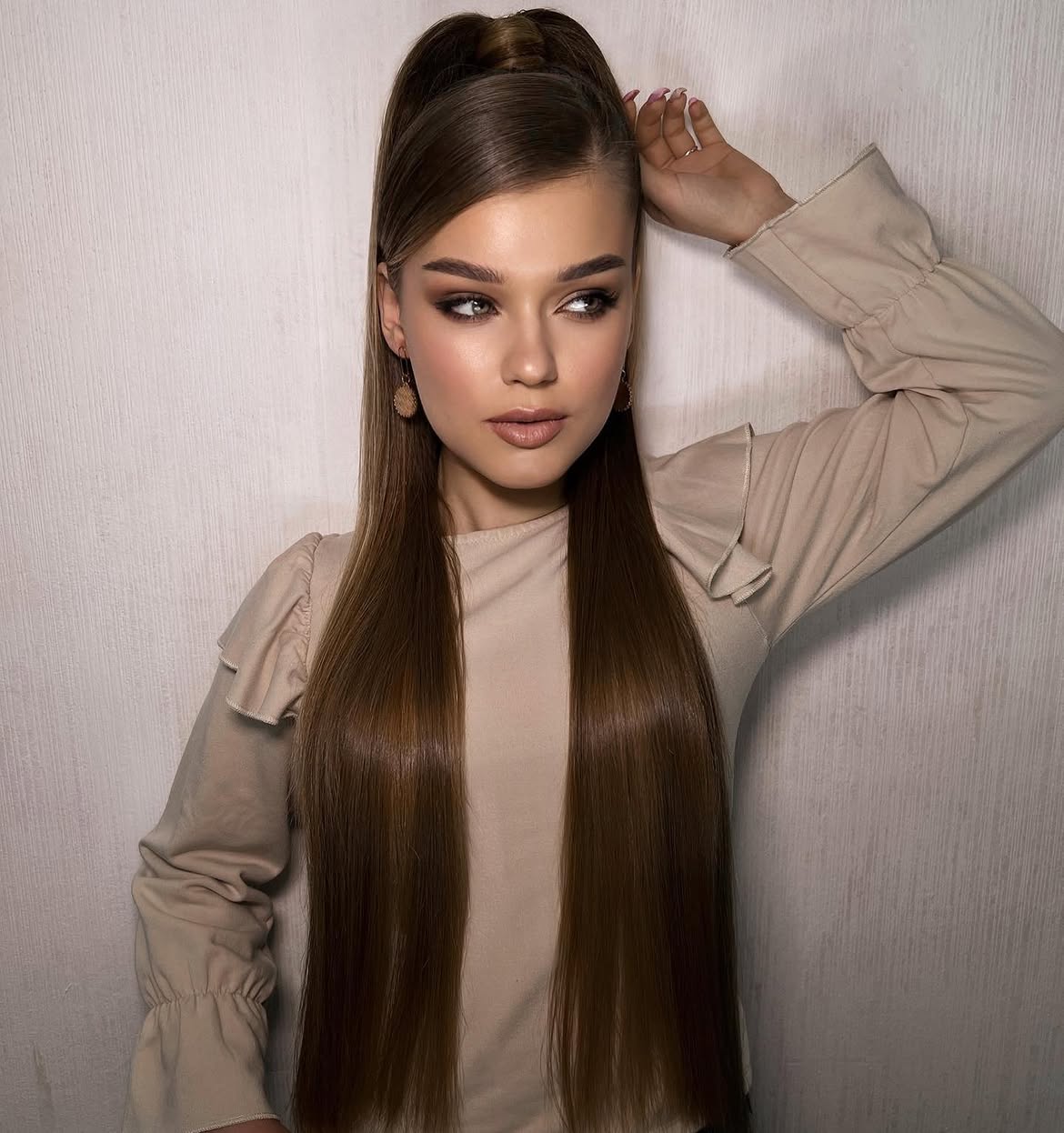 Sleek High Ponytail With Face-Framing Strands