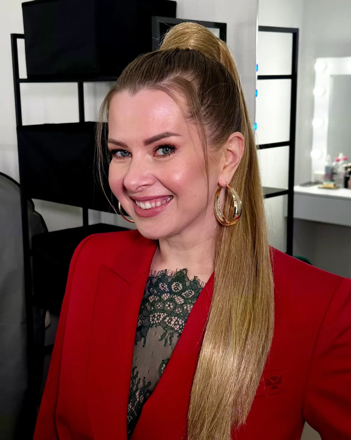 Sleek High Ponytail With Face Framing Strands