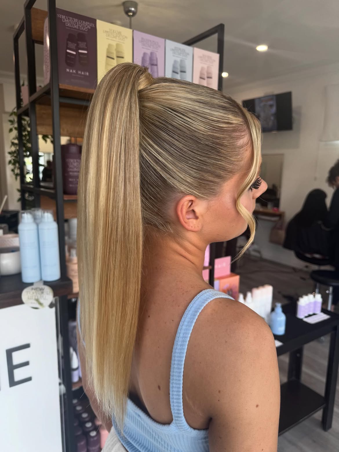Sleek High Ponytail With Face Framing Strands