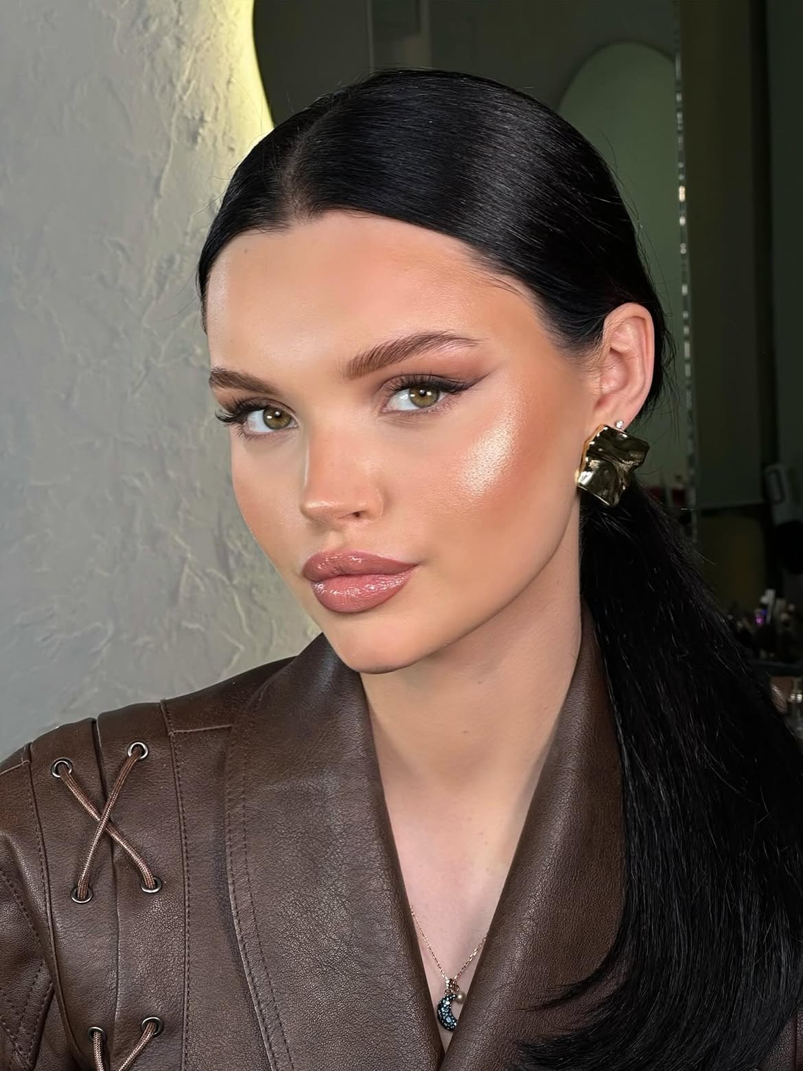 Sleek High Ponytail With Face-Framing Tendrils