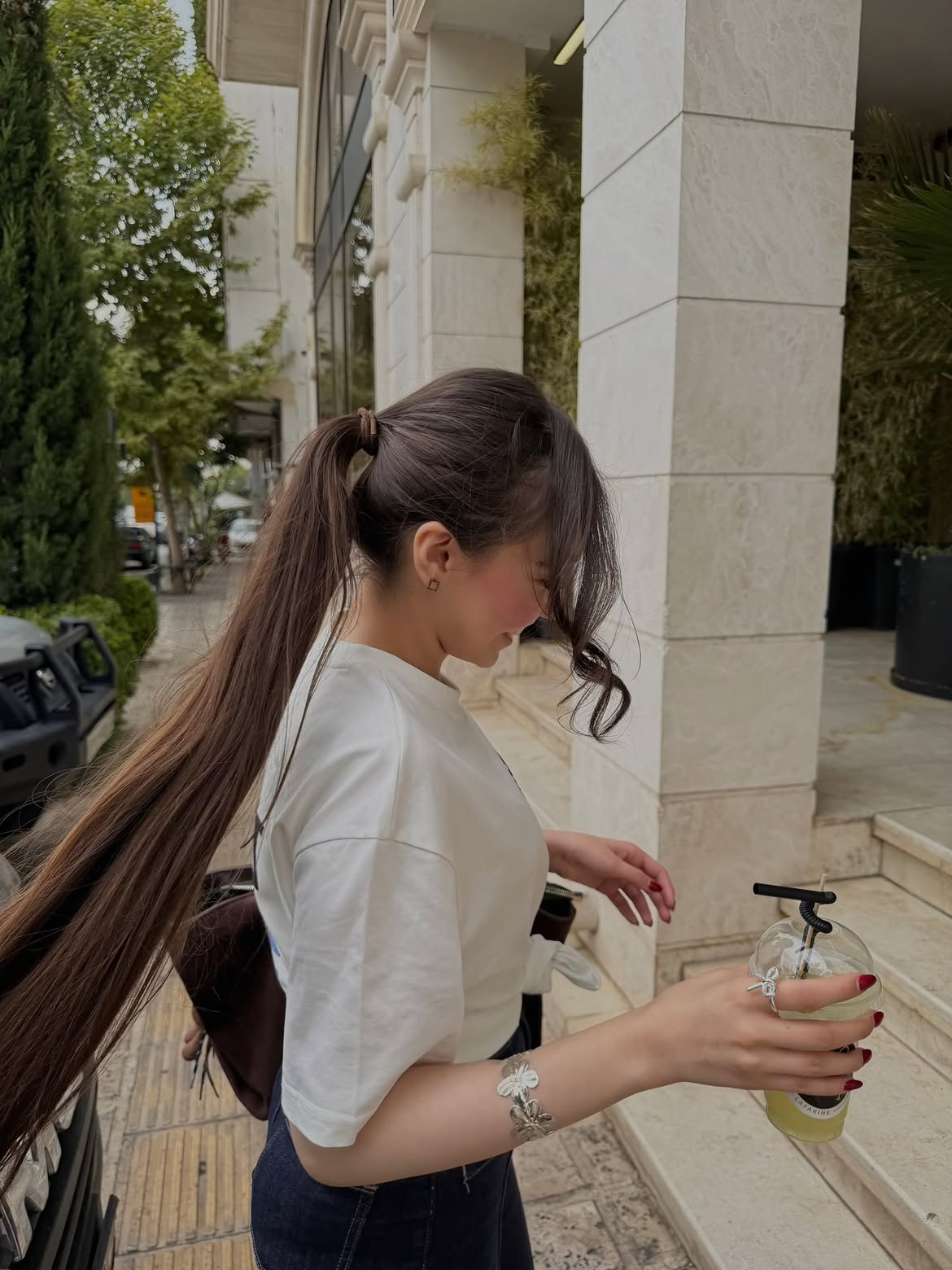 Sleek High Ponytail With Face Framing Tendrils