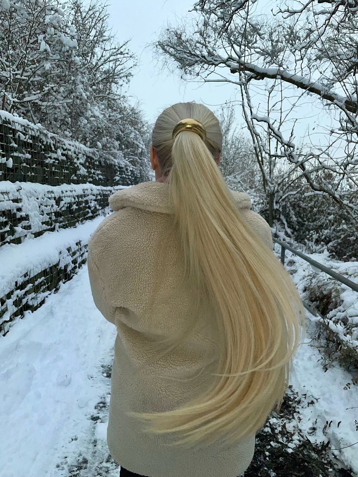 Sleek High Ponytail With Gold Cuff