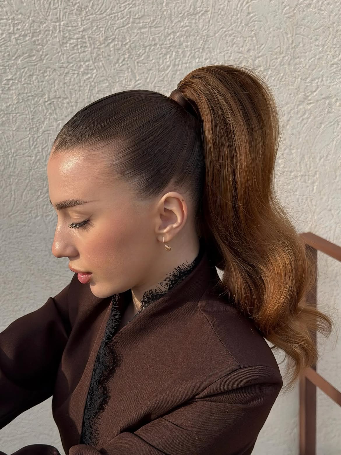 Sleek High Ponytail With Soft Wavy Ends