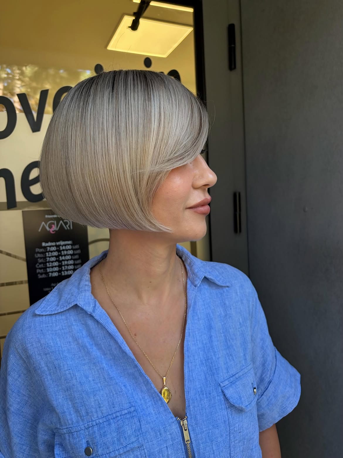 Sleek Platinum Blonde Bob With Side-Swept Bangs
