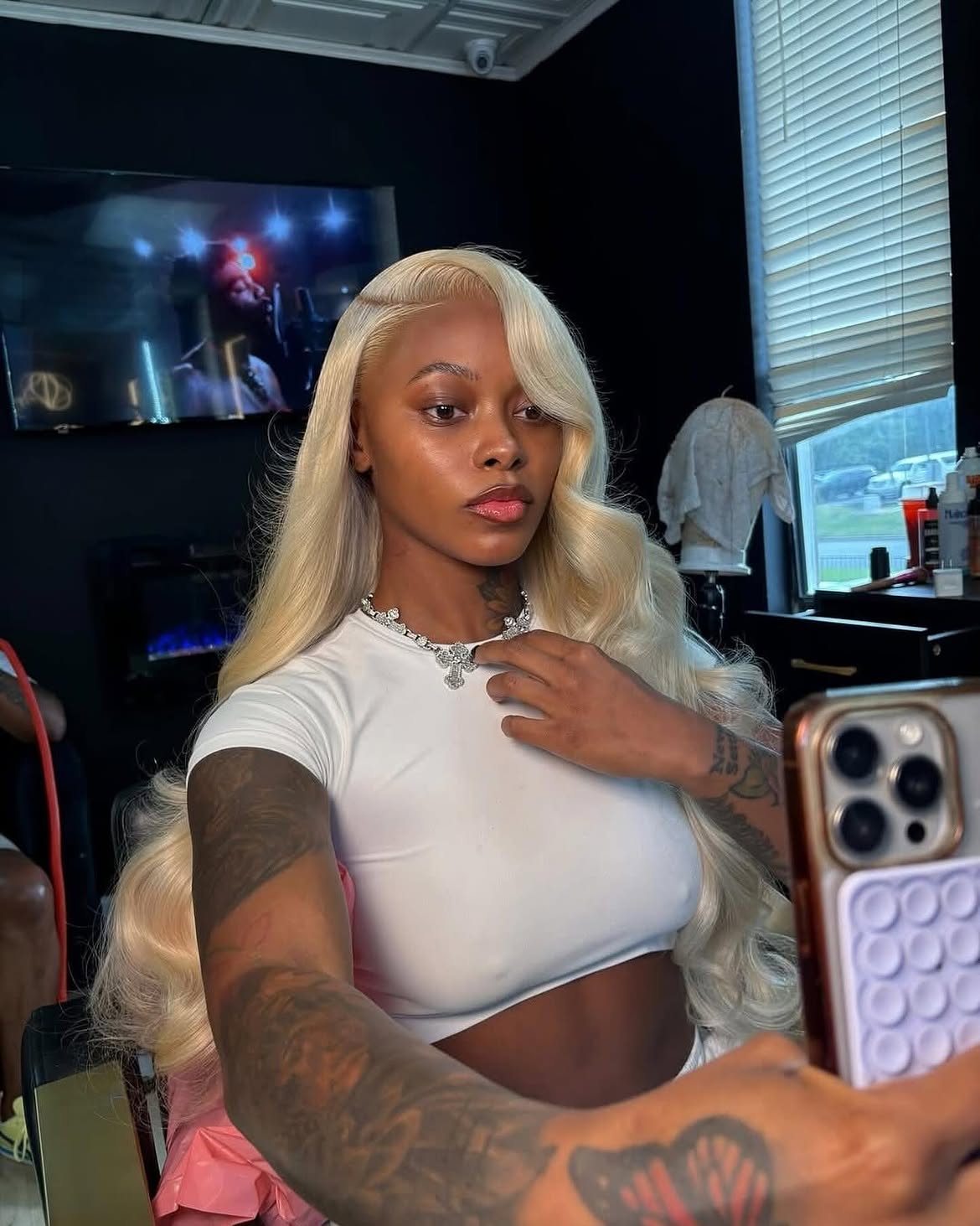 Sleek Platinum Blonde Silk Press With Deep Side Part