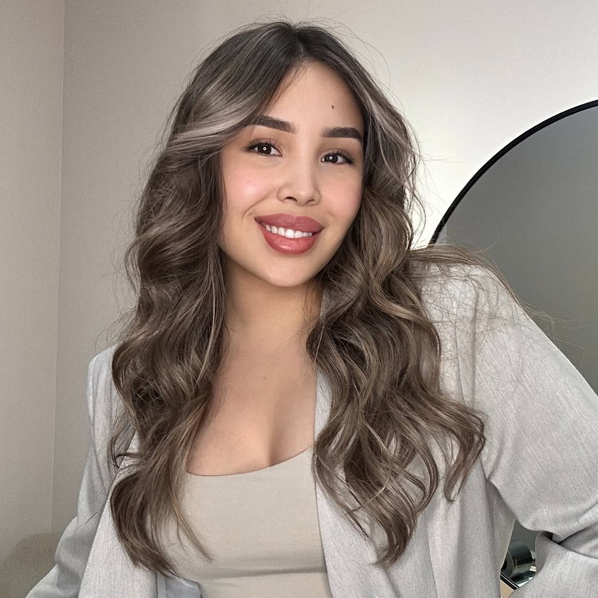 Soft Ashy Blonde Waves With Face-Framing Highlights