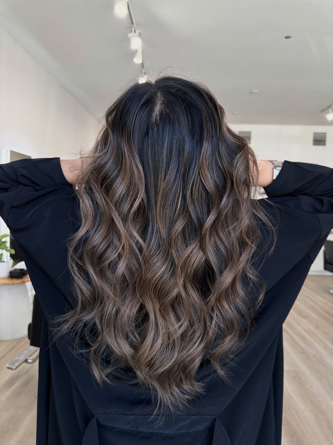 Soft Bronde Highlights on Dark Wavy Hair