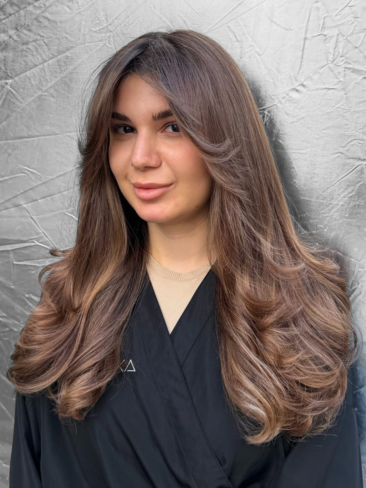 Soft Bronde Layers With Face-Framing Bangs