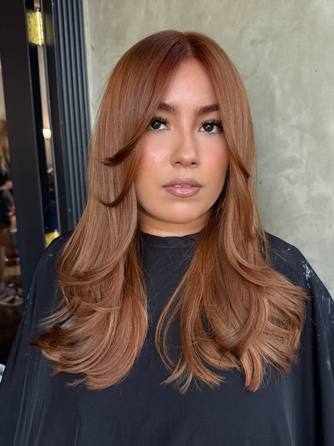 Soft Copper Brown Layers With Face Framing Curtain Bangs