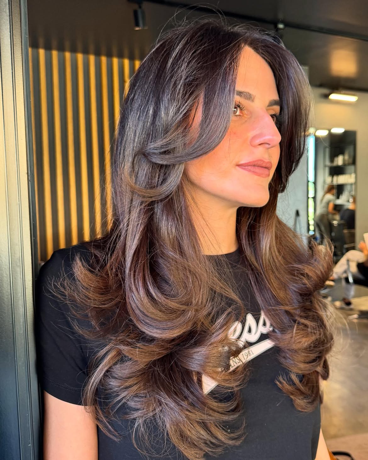Soft Curtain Bangs With Voluminous Brown Waves