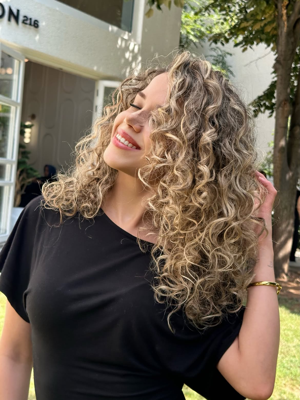 Sun-Kissed Blonde Curls With Warm Honey Tones