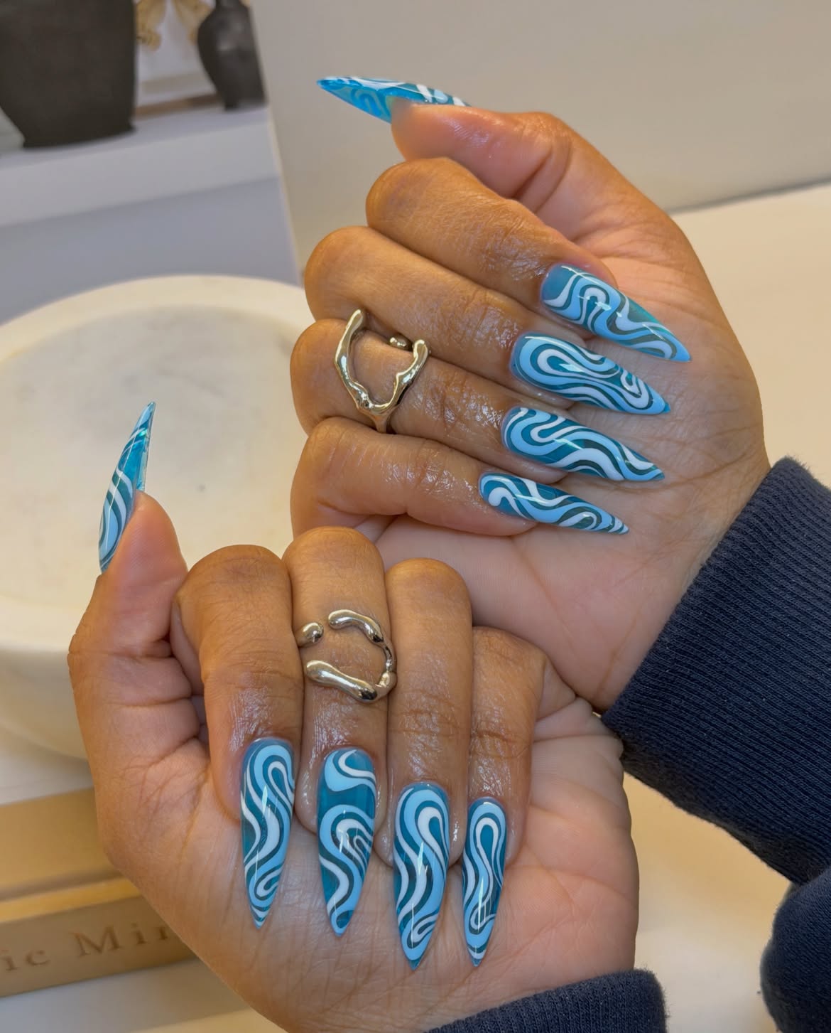 Swirling Aqua Blue Matte Stiletto Nails