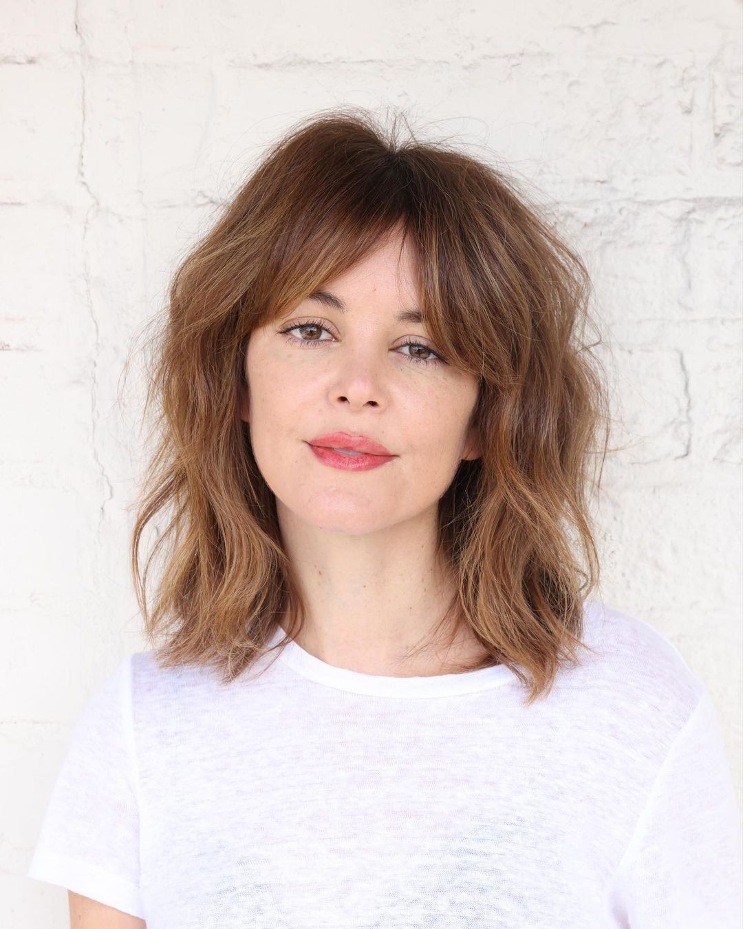 Textured Shag With Curtain Bangs For Medium Hair