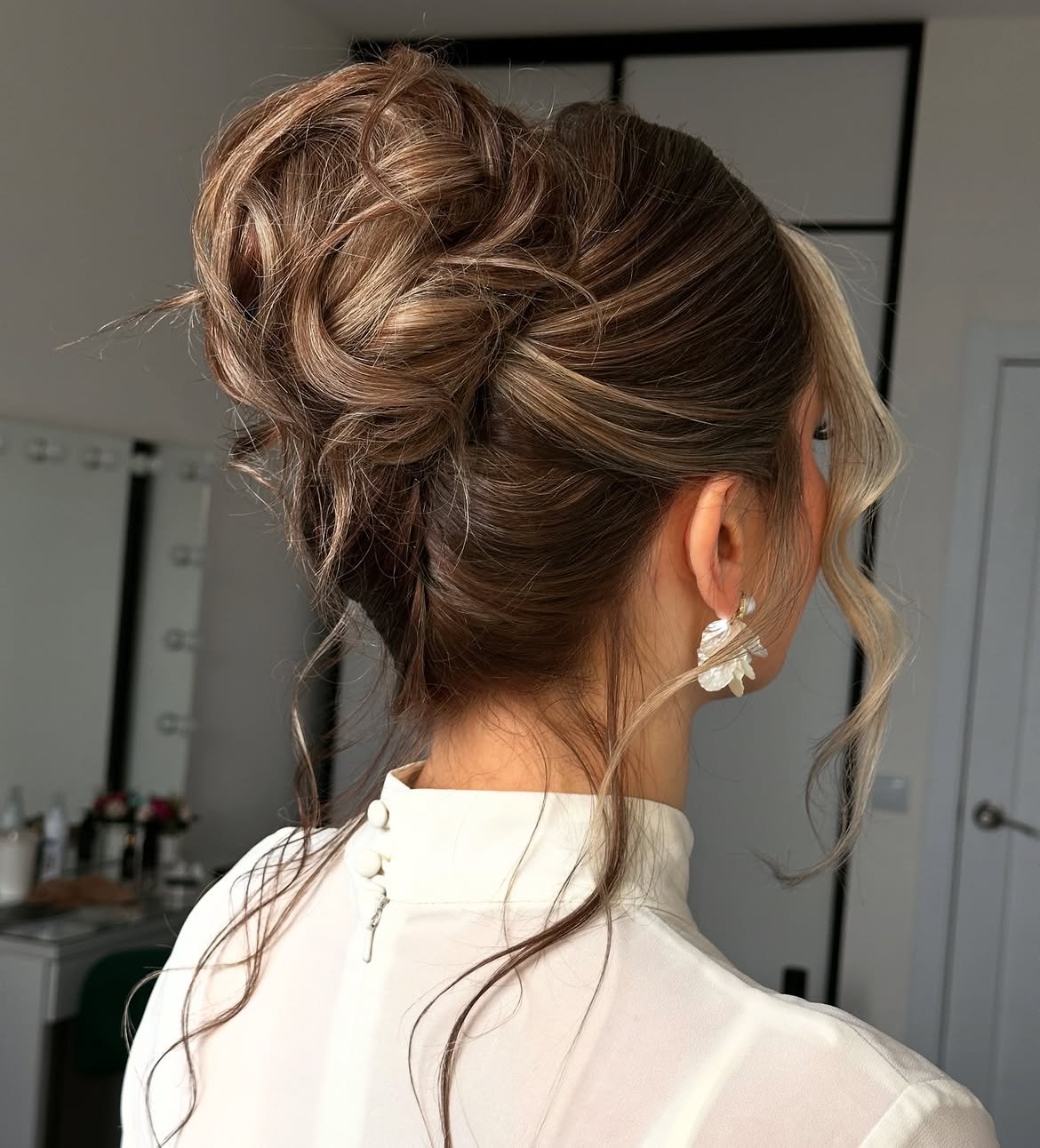 Textured Updo With Face-Framing Tendrils