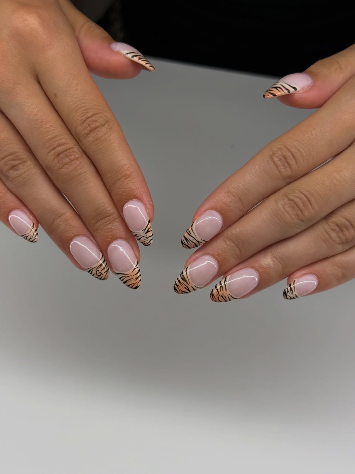 Tiger Print Accent French Tip Almond Nails
