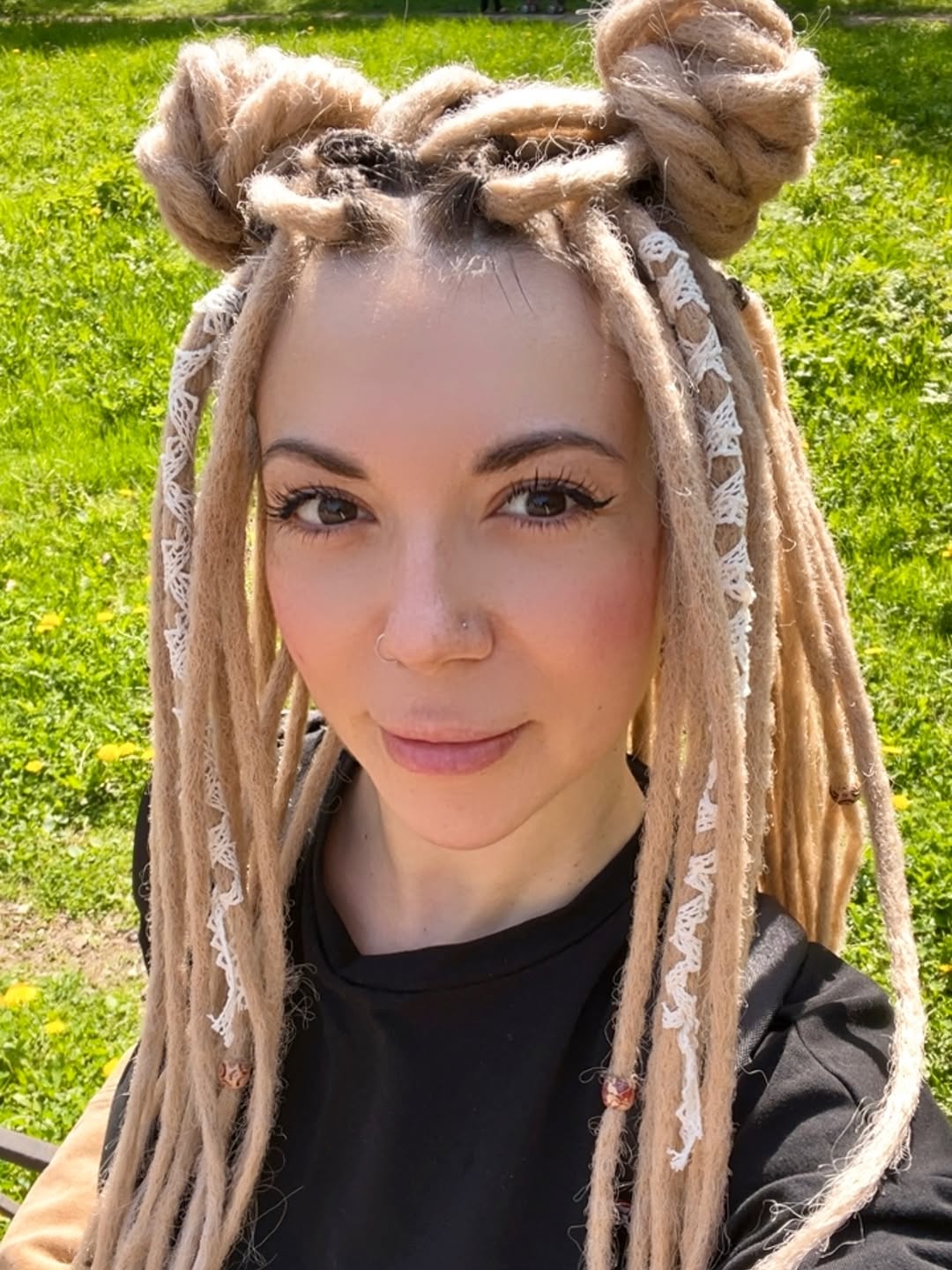 Two-Tone Dreadlock Space Buns With White Accents