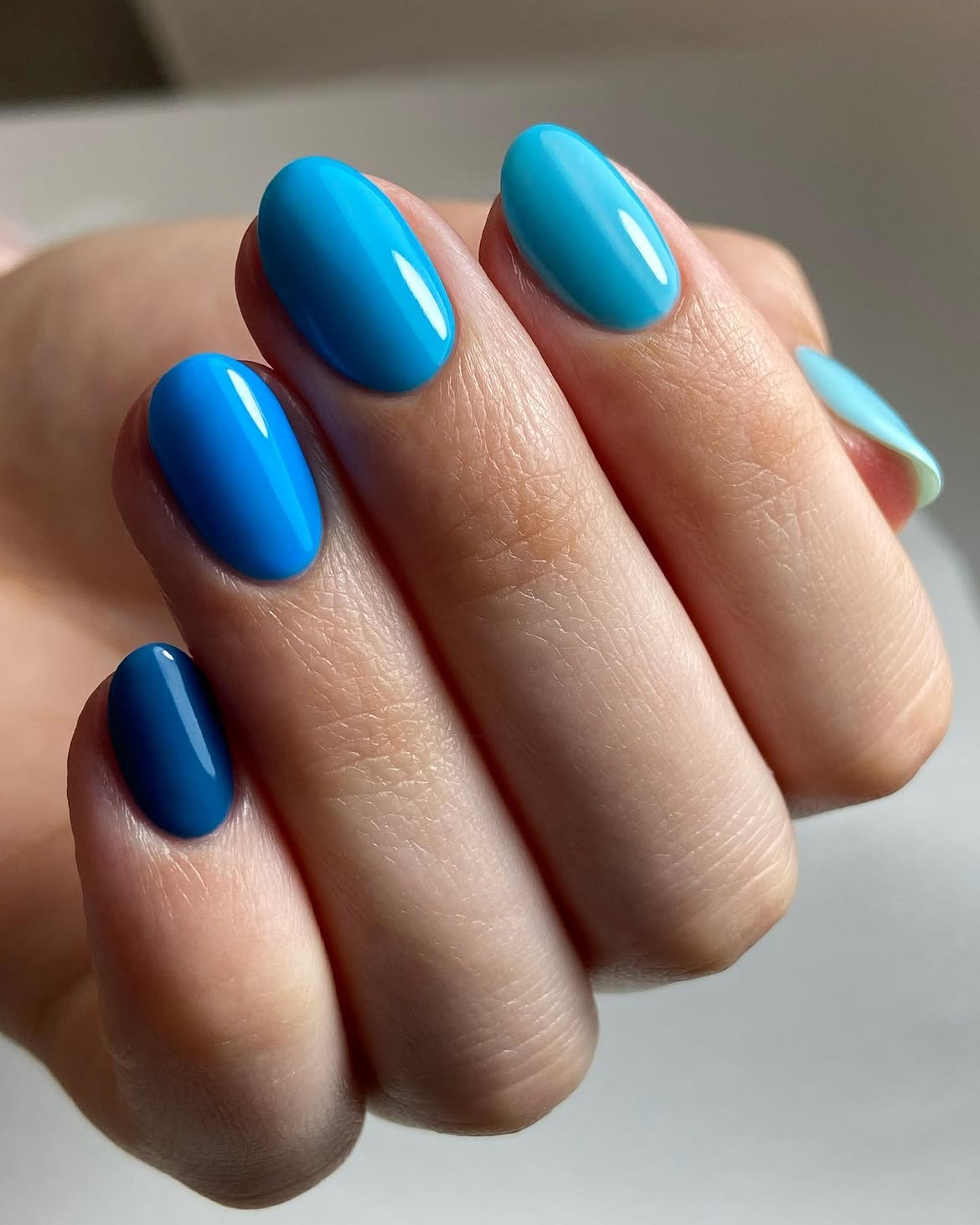 Vibrant Ocean Blue Glossy Oval Nails