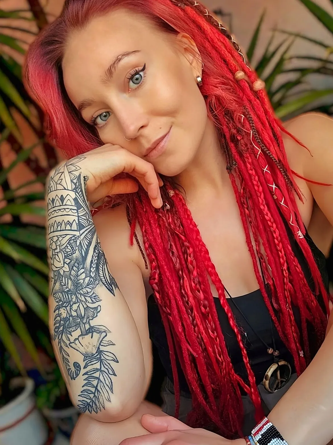 Vibrant Red Dreads With Braided Accents