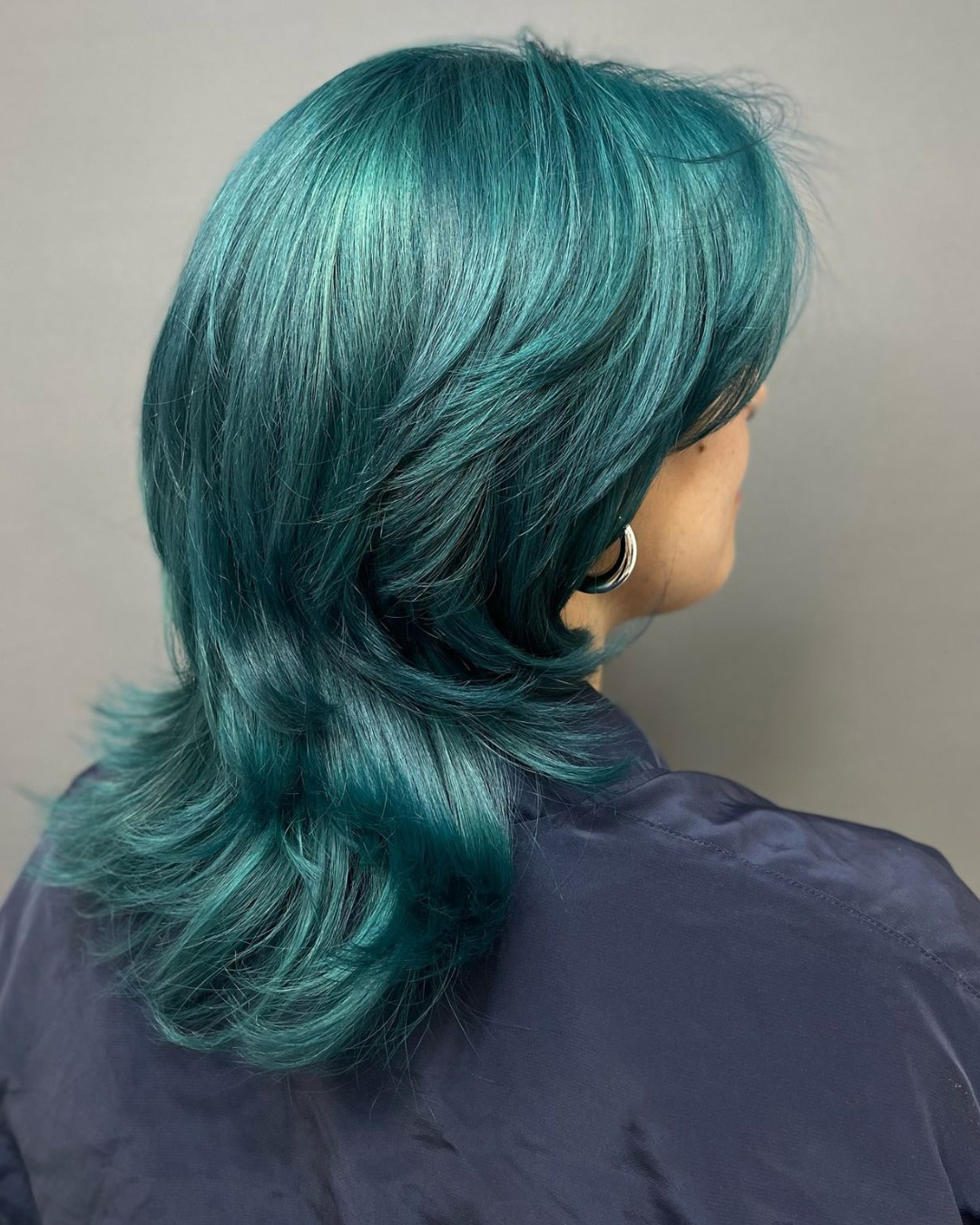 Vibrant Teal Shag With Face Framing Layers