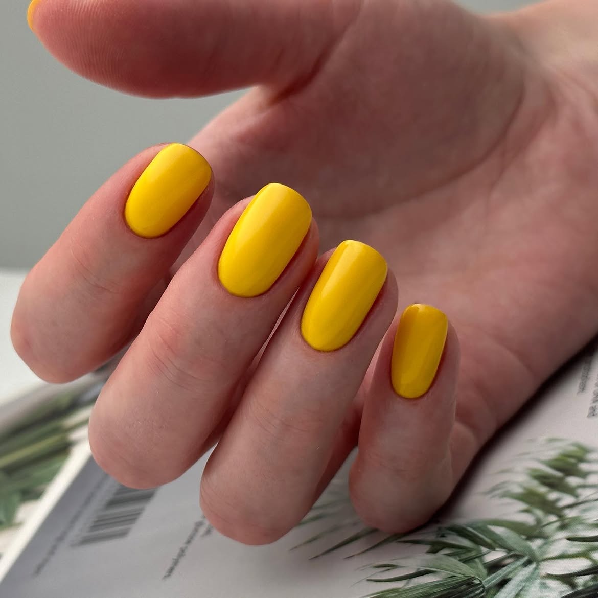 Vibrant Yellow Glossy Short Oval Nails