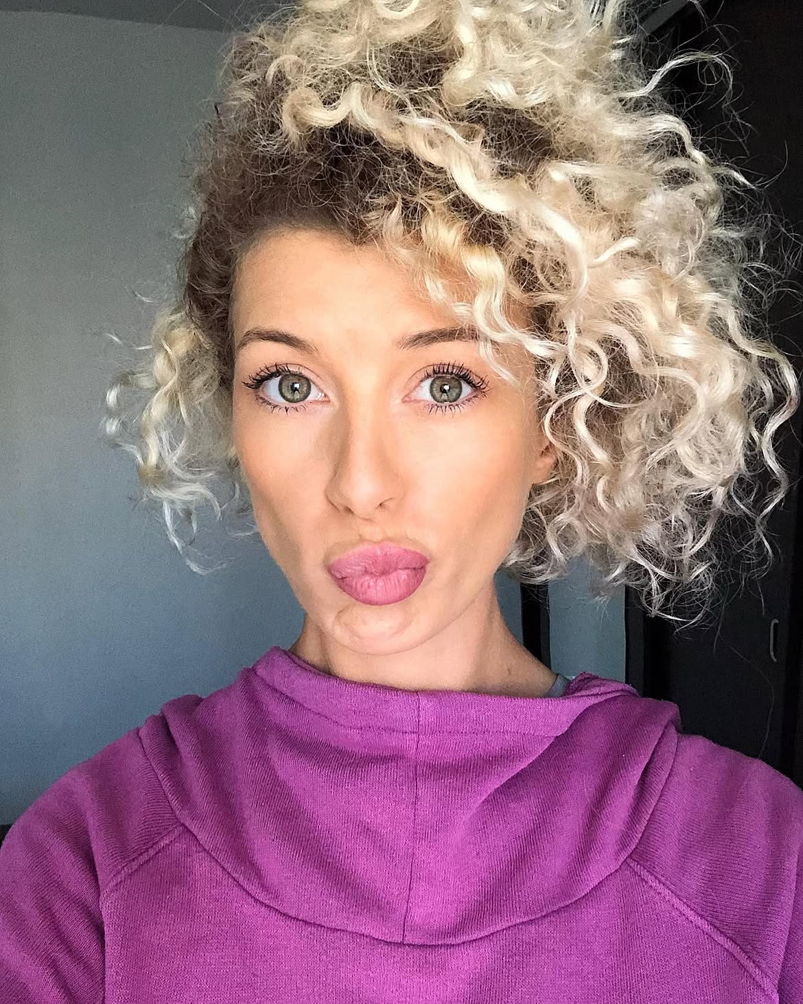 Voluminous Blonde Curly Bob With Textured Layers