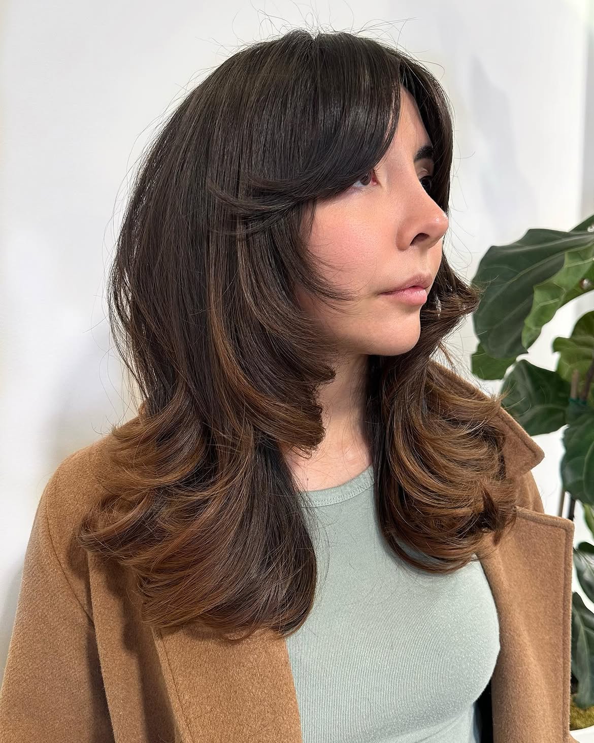 Voluminous Bronde Layers With Face-Framing Bangs