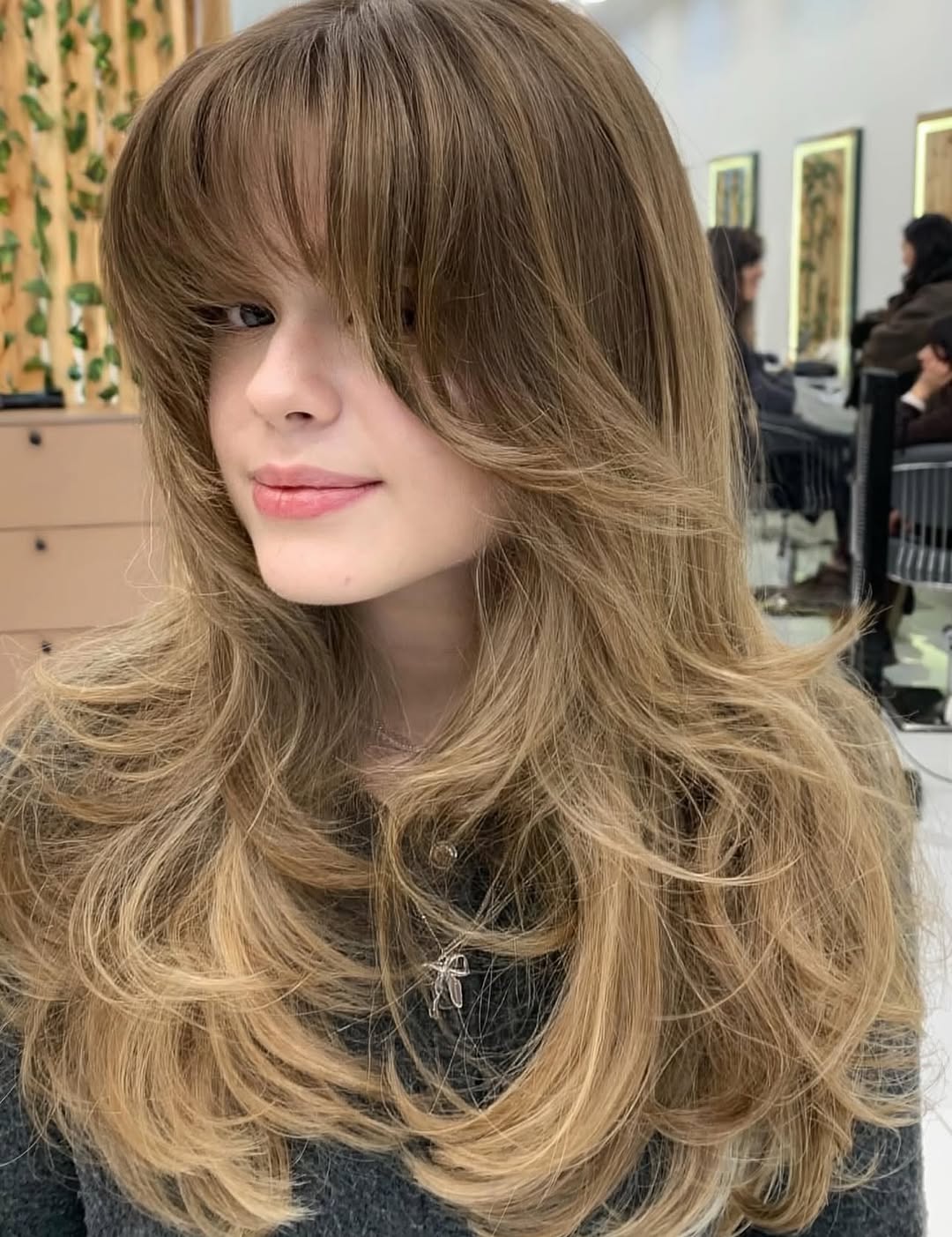 Voluminous Curtain Bangs With Long Layered Waves