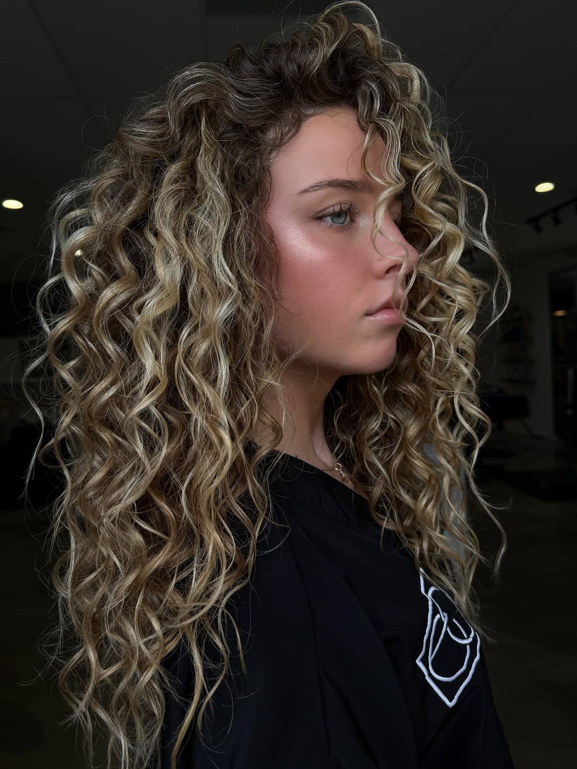 Voluminous Honey Blonde Curls With Dimension