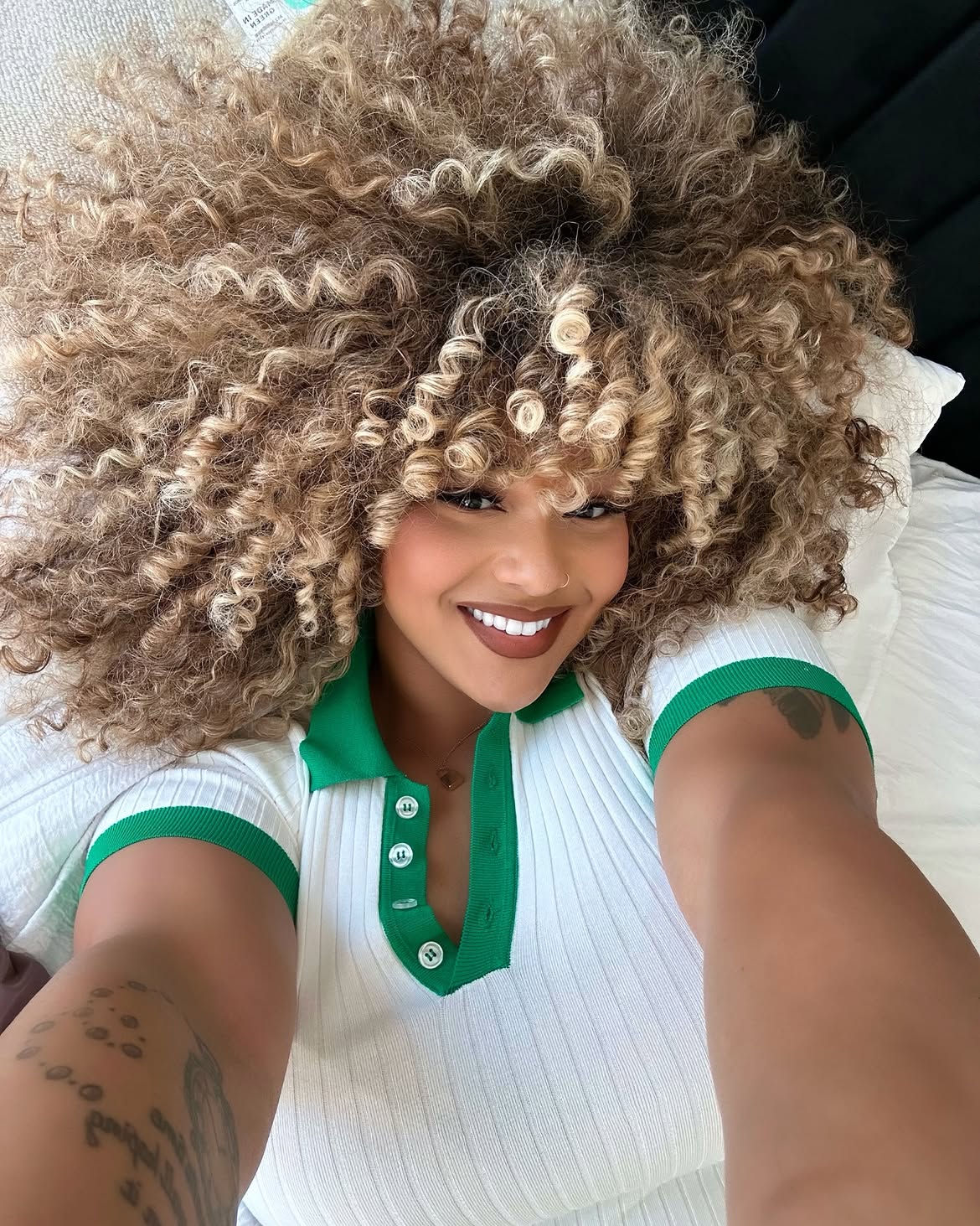 Voluminous Honey Blonde Curls With Face-Framing Highlights