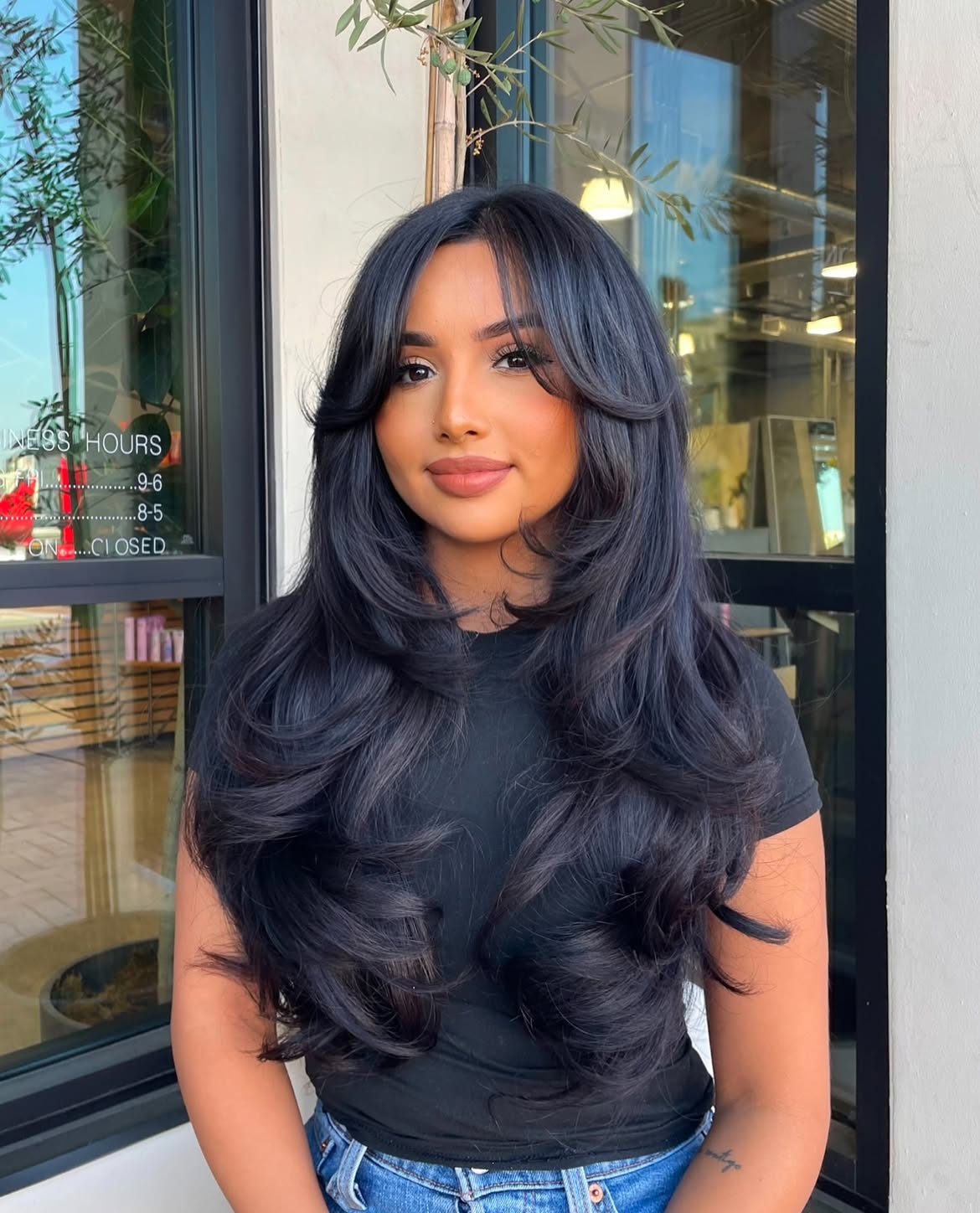 Voluminous Layered Black Hair With Classic Curtain Bangs